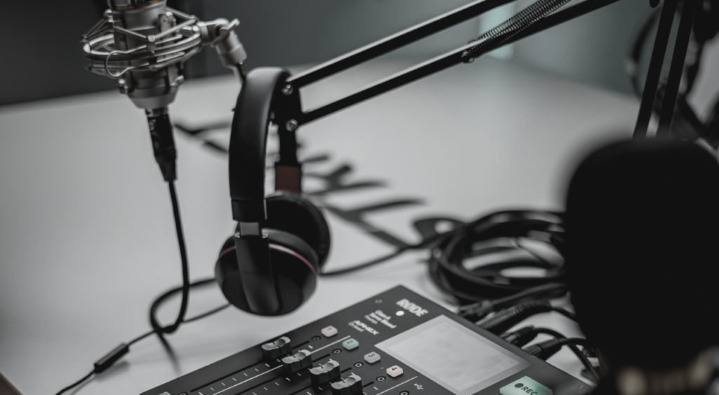 headphones on microphone over soundboard